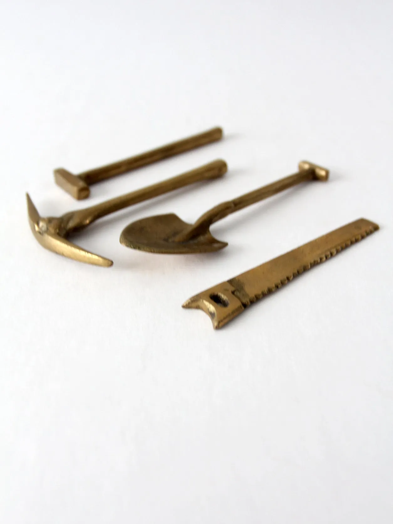 mid-century mini figurative brass tool set