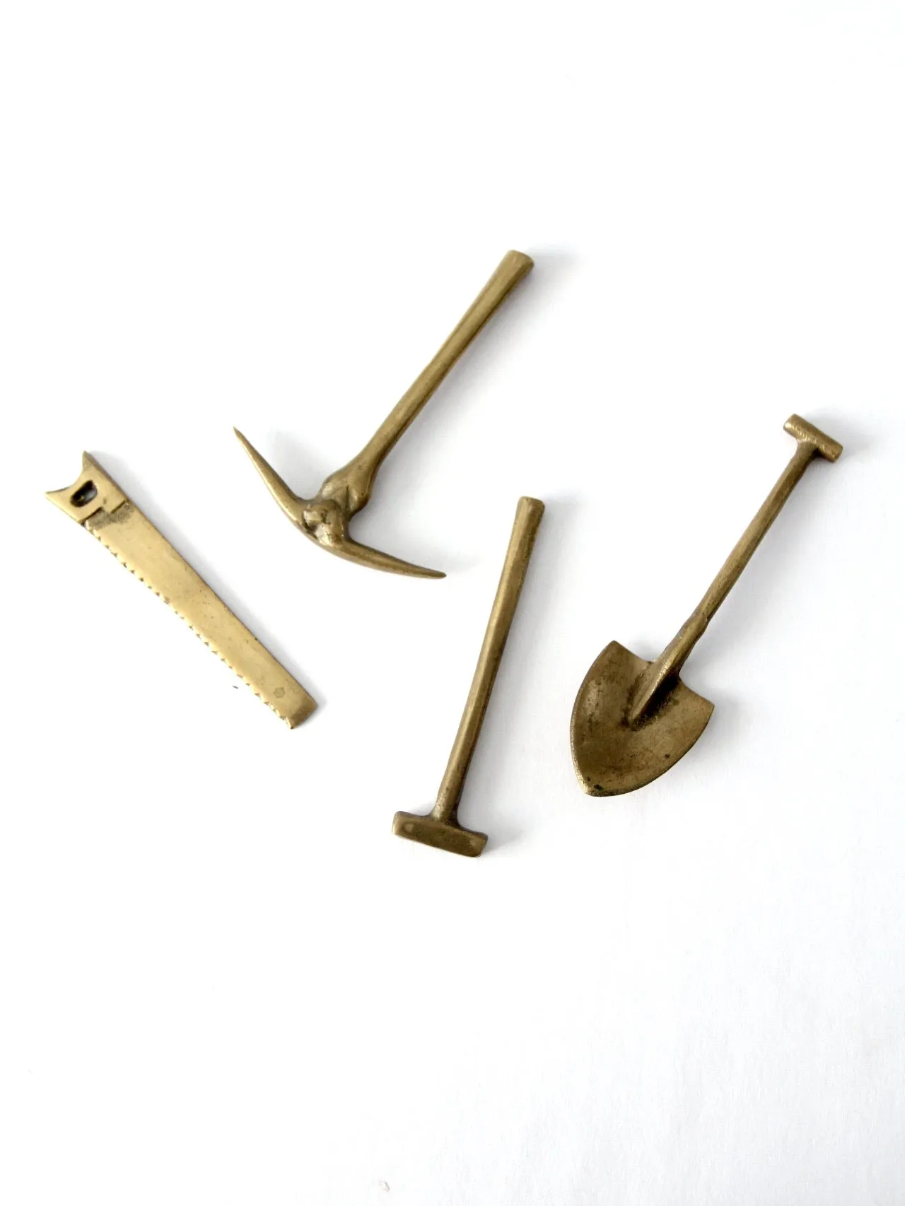 mid-century mini figurative brass tool set