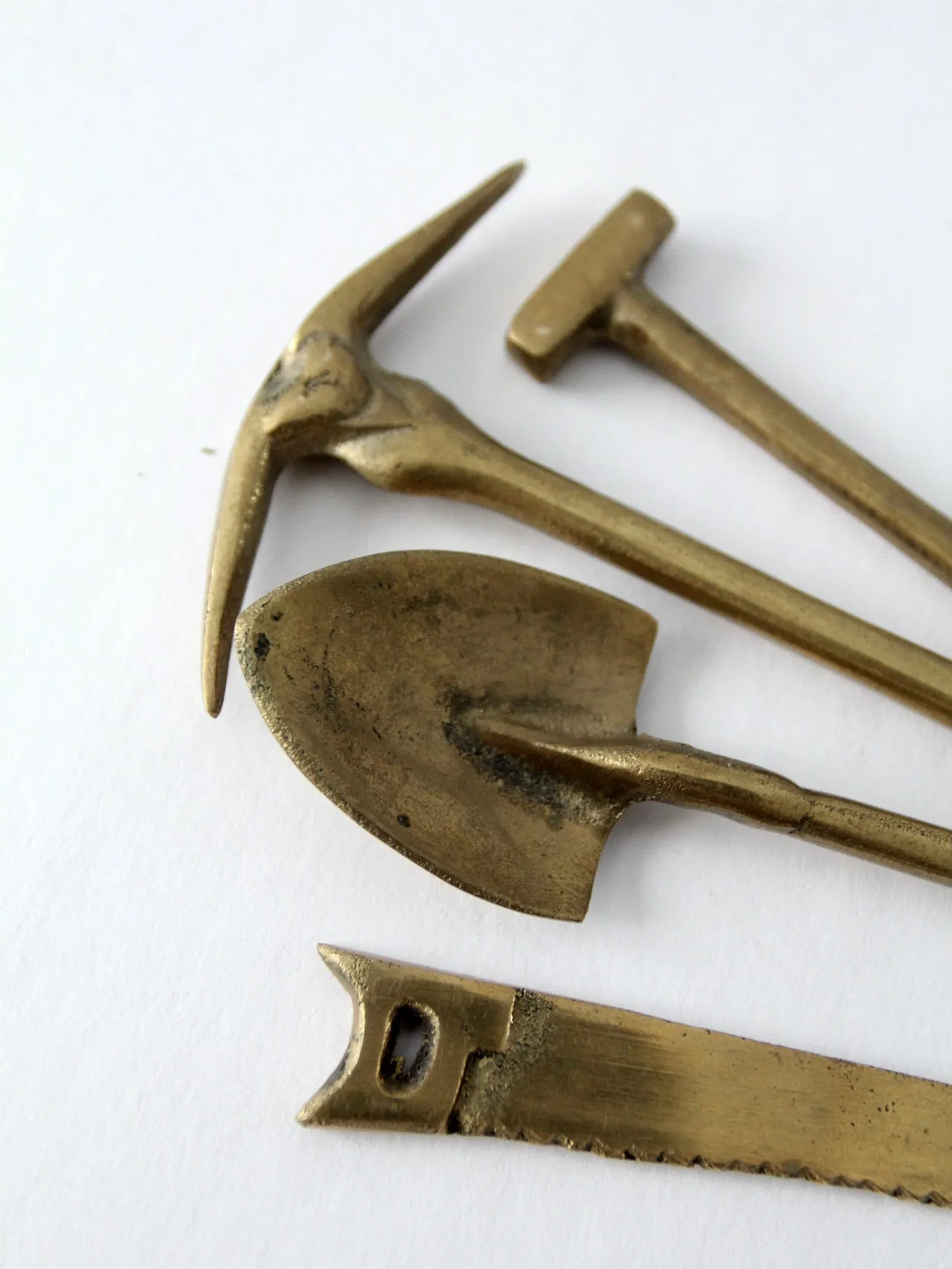 mid-century mini figurative brass tool set