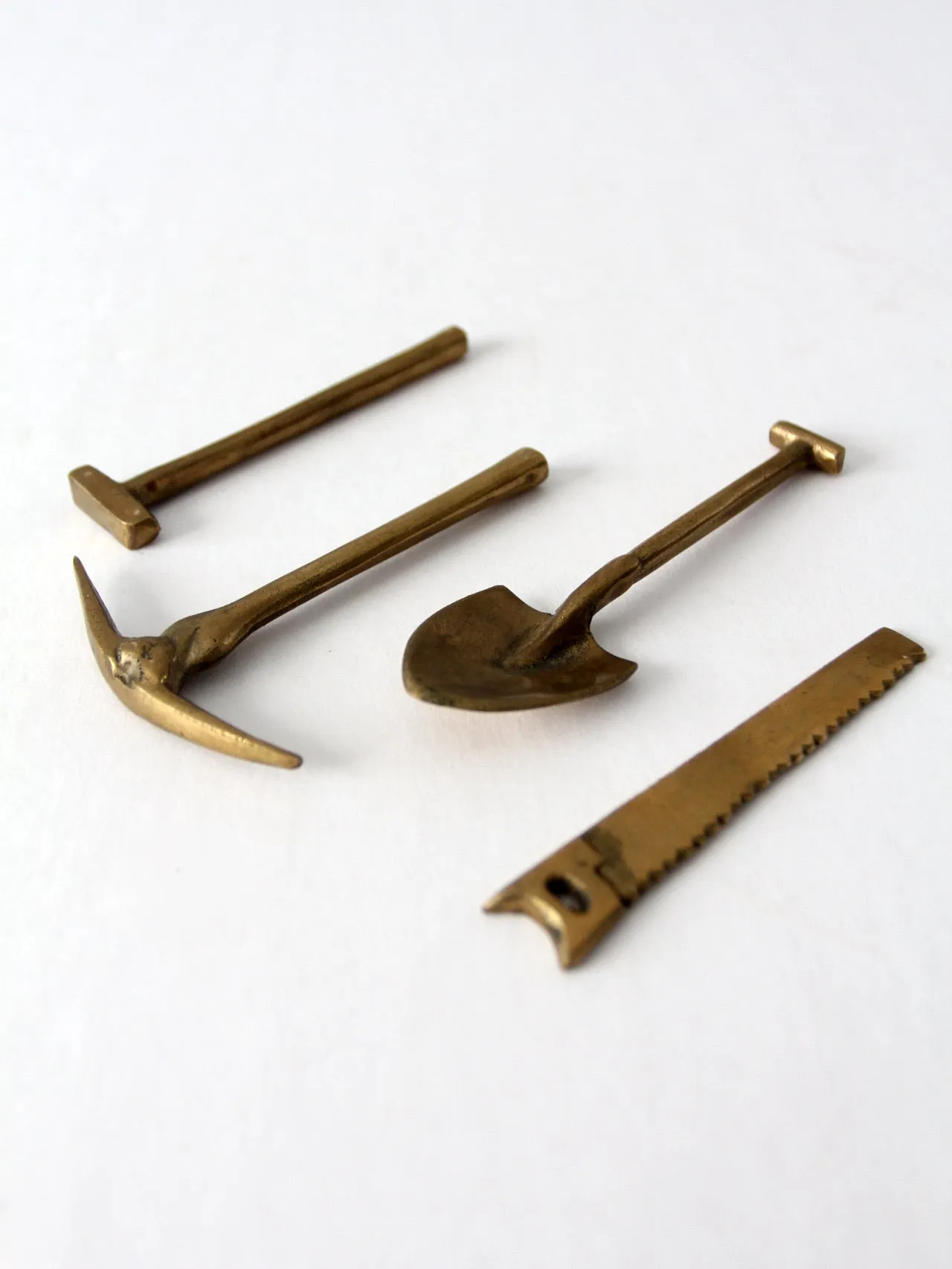 mid-century mini figurative brass tool set