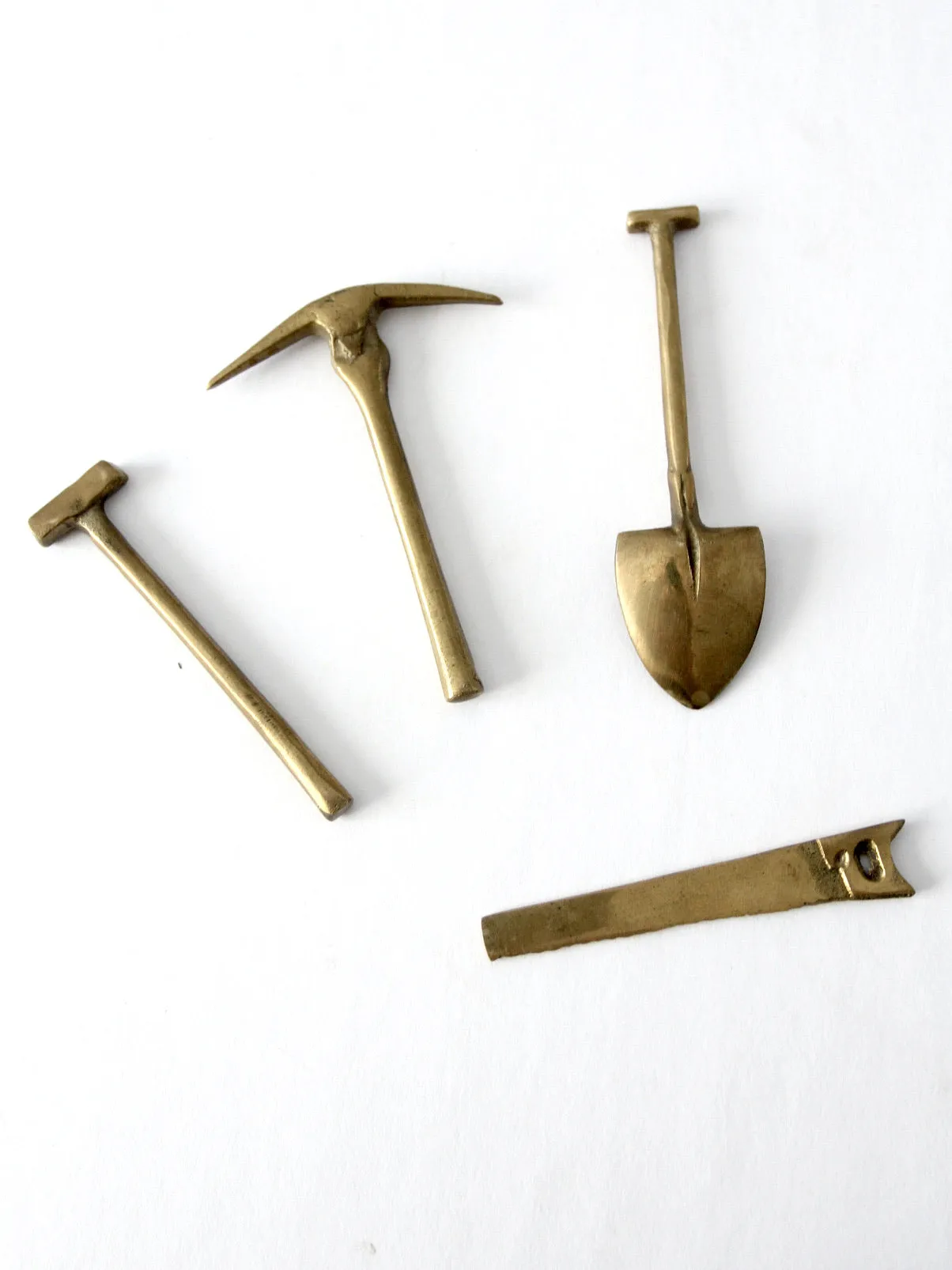 mid-century mini figurative brass tool set